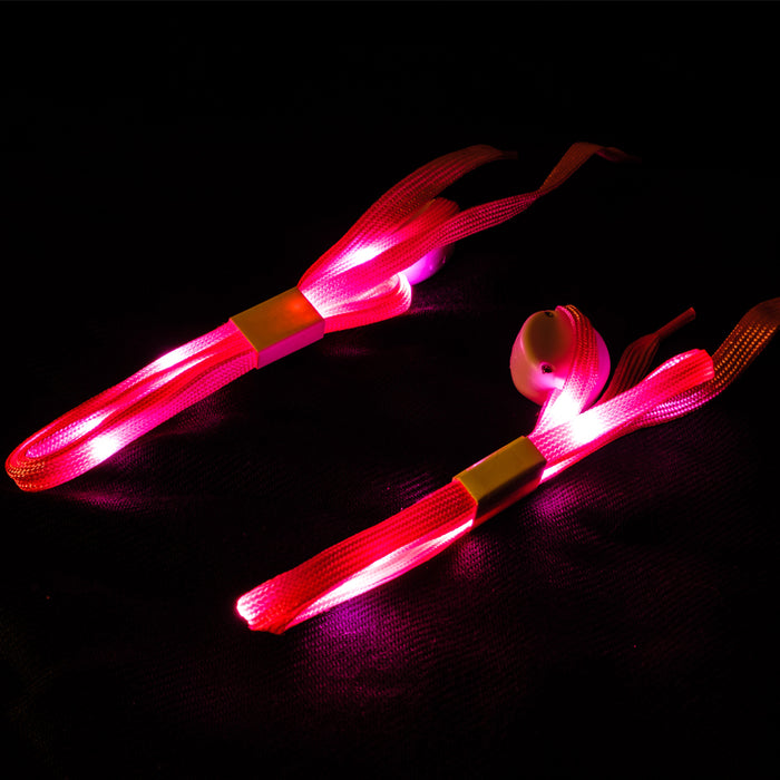An upclose view of the pink shoelaces lit up with pink LED lights