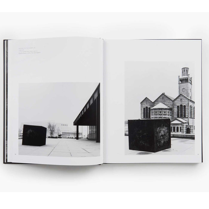 inside "Forged Steel", showing 2 black & white images of a steel cube in front of a modern building & an old-style building