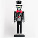 Día de los Muertos Groom with a painted skull face & top hat, wearing a black suit with white bones showing and a red bowtie
