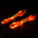An upclose view of the orange shoelaces lit up with orange LED lights