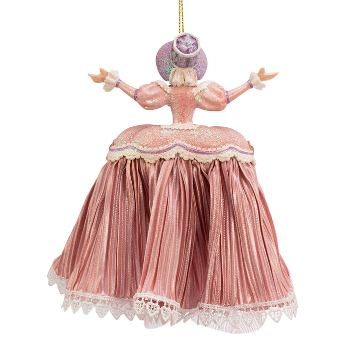 the back of a mother Ginger ornament with a pink gown, displaying the width of her skirt and the glitter on her top
