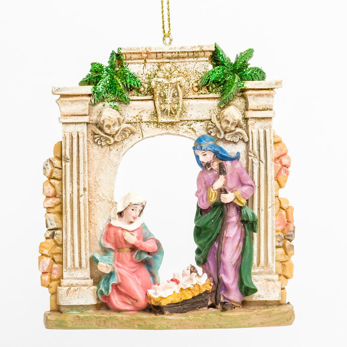 a nativity scene ornament with Mary & Joseph looking over baby Jesus in a manger, in front of a stone arch with pillars 
