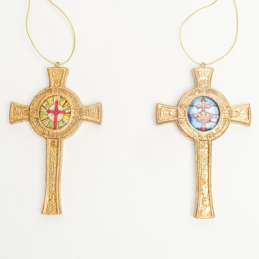 2 gold cross ornaments with a circle and design in the center shown together