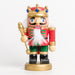 a short king nutcracker holding a gold scepter, wearing a red and green glitter outfit and a red crown with blue gemstones